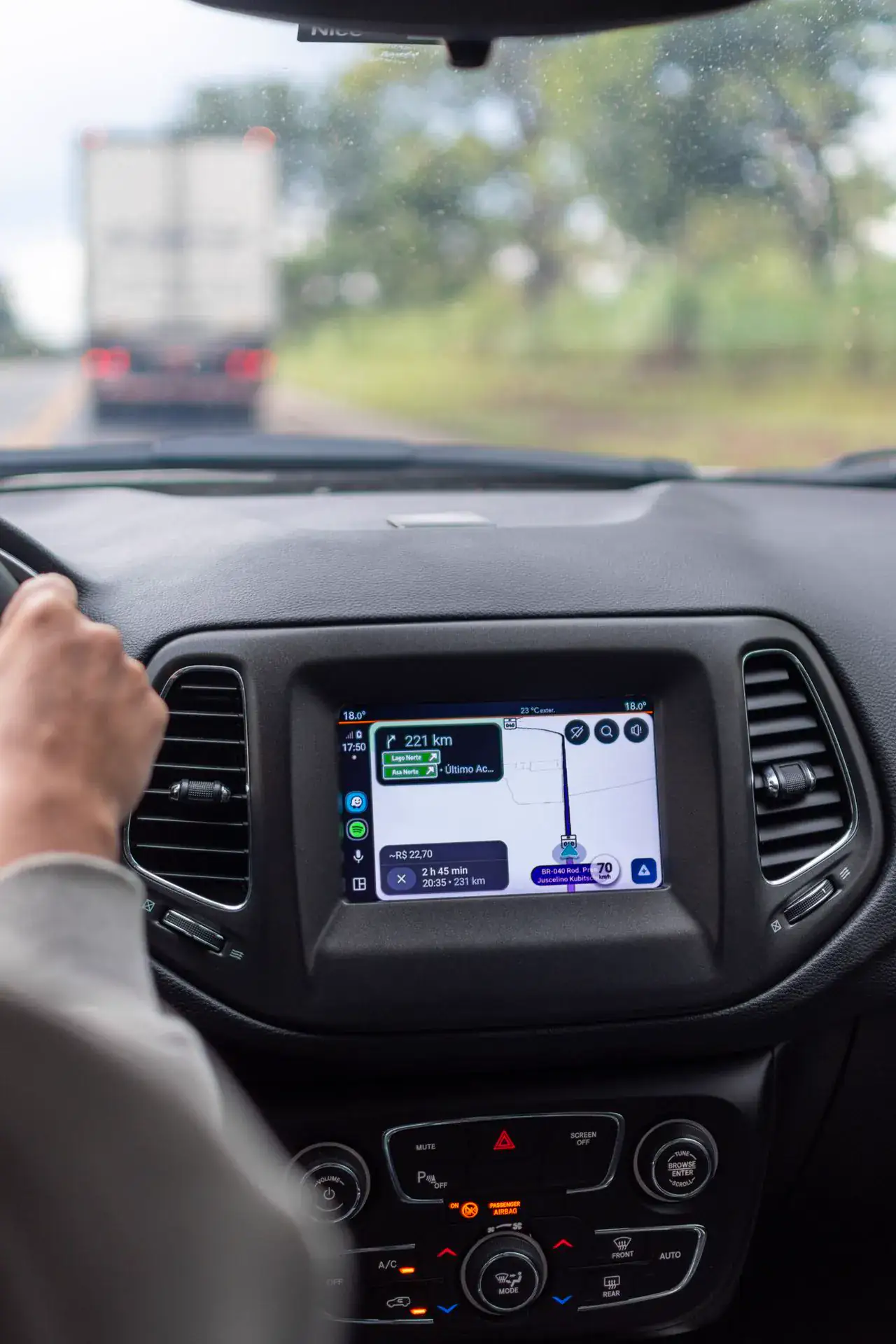 Driver using in-vehicle GPS navigation on a trip